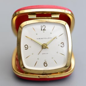Reloj despertador mecánico vintage de viaje WESTCLOX con joyas de Alemania en funcionamiento