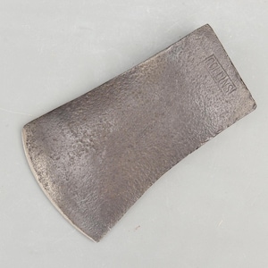 May include: A vintage axe head with a curved blade and a textured, weathered surface. The word "ROLLINS" is stamped on the top. The axe head is made of metal and has a rustic, antique appearance.