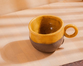 Yellow cup with round handle