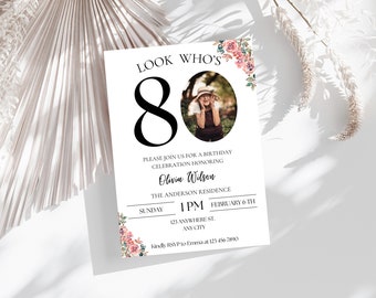 May include: A white invitation card with pink floral accents. The card features a photo of a woman in a hat and the text "LOOK WHO'S 80". The invitation is for a birthday celebration honoring Olivia Wilson at The Anderson Residence on Sunday, February 6th at 1 PM. The address is 123 Anywhere St., Any City. Kindly RSVP to Emma at 123-456-7890.