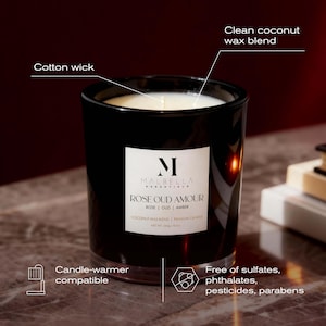 May include: A black glass candle with a white label that reads "ROSE OUD AMOUR". The candle has a cotton wick and a clean coconut wax blend. It is candle-warmer compatible and free of sulfates, phthalates, pesticides, and parabens. The net weight is 240g / 8.5oz.
