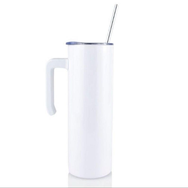 May include: White stainless steel travel mug with a handle and a lid. The mug has a straw sticking out of the lid.