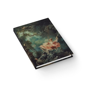 May include: A hardcover journal featuring a classical painting of a woman on a swing in a garden. The artwork depicts a woman in a pink dress, with a lush green background. The journal has a white background.