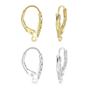 May include: Two pairs of earring findings, one pair is gold and the other is silver. Both pairs have a textured, diamond-shaped design.