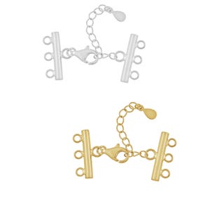 May include: Two silver and gold multi-strand necklace clasps with a lobster claw clasp and extender chain.