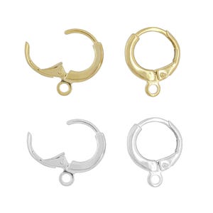 May include: Four leverback earring findings. Two are gold-colored, and two are silver-colored. Each finding has a hinged lever and a small loop for attaching a charm or bead. The earrings are shown against a white background.
