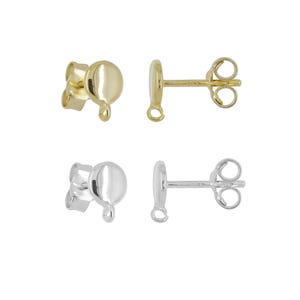 May include: Two pairs of stud earrings. One pair is gold-colored, featuring a round disc and a post with a butterfly backing. The other pair is silver-colored, with a similar design. Both pairs are displayed against a white background.