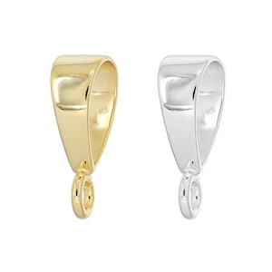 May include: Two metal jewelry bails, one in a polished gold tone and one in a polished silver tone. Each bail features a smooth, tapered, triangular body with a small, circular jump ring attached at the bottom for connecting pendants or charms.