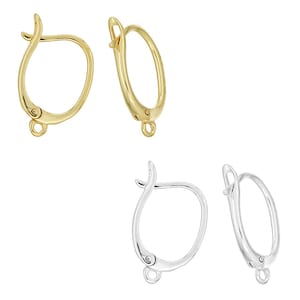 May include: A pair of gold-toned leverback earring findings and a pair of silver-toned leverback earring findings. Each earring component features a curved wire frame with a hinged closure and a small circular loop at the base for attaching charms.