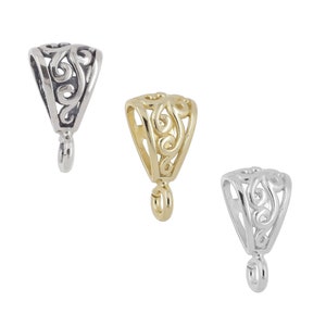 May include: Three jewelry bails with an openwork filigree scroll pattern. One bail is dark silver-toned, one is gold-toned, and one is bright silver-toned. Each piece features a triangular top section and a small circular loop at the bottom.