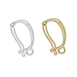 May include: Two earring findings, one silver-colored and one gold-colored, are displayed against a white background. Each finding has a curved, oval shape with a small loop and three decorative beads.