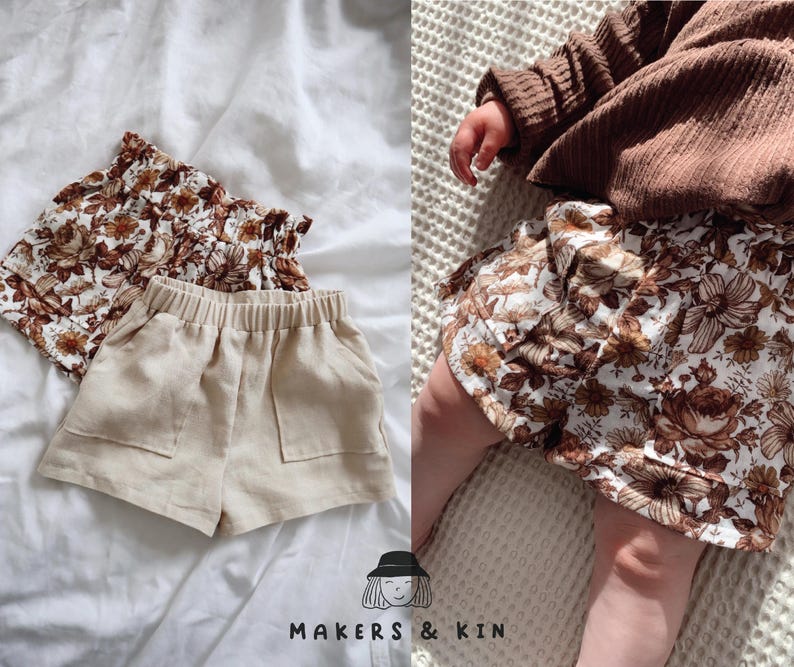May include: Two pairs of toddler shorts. One pair is beige linen with pockets and the other is white with a brown floral print. The floral print shorts are being worn by a child.