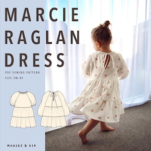 Puede incluir: Un patrón de costura en PDF Marcie Raglan Dress para tallas 3M-8Y de Makers & Kin. La imagen muestra un vestido blanco con volantes y estampado de cerezas rojas, mangas raglán y cierre de lazo en la espalda, junto a ilustraciones técnicas.