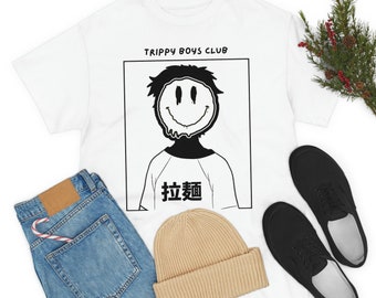 May include: White t-shirt with a black and white graphic of a person with a dripping smiley face and the text "Trippy Boys Club" and "Catch" in Japanese characters.