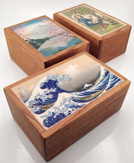 A handcrafted cherry-wood Japanese puzzle box — a genuine brain-teaser desk object with centuries of craft tradition behind it.