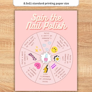 May include: A pink printable game sheet with the text "Spin the Nail Polish." The game includes instructions to paint various designs on nails. The sheet is designed for 8.5x11 inch paper.