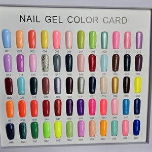 May include: A nail gel color card displays 60 different nail polish colors. The colors range from light blue to dark navy, including shades of orange, pink, green, and purple. Each color is numbered, with the text "NAIL GEL COLOR CARD" at the top.