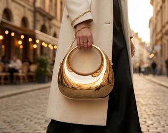 Skulpturale Metallic Clutch-Tasche, hochglänzende Handtasche, moderne runde Handtasche mit Griff, schicke Abend-Party-Tasche, futuristische Tasche