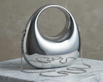Skulpturale Metallic Clutch Tasche, futuristische Handtasche mit Spiegel, minimalistische ovale Schultertasche, moderne Abendtasche mit Kette, Geschenk für sie