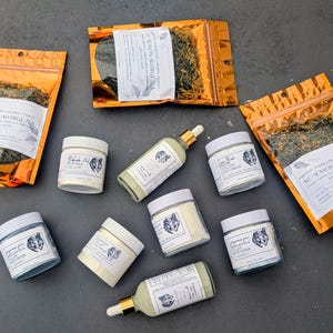 Skincare and wellness collection on dark gray background