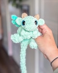 One crochet small baby dragon plushie, handmade stuffie, personalised colours, amigurumi toy made with plush chenille yarn, unstuffed body product logo
