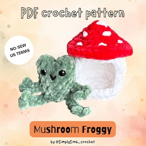 May include: A PDF crochet pattern for a Mushroom Froggy. The image features a green plush frog and a red and white mushroom house. Text includes PDF crochet pattern, NO-SEW US TERMS, Mushroom Froggy, and by @SimplySima_crochet.