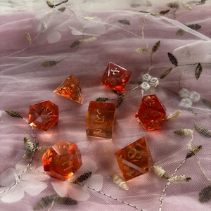 Handmade Sharp Edge Dnd Dice, 7 Piece Set - Translucent Red Resin Dice with Red Swirls and Gold Numbers - The Warrior