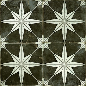 May include: Black and white geometric tile pattern with a starburst design. The tile has a distressed, vintage look.