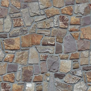 May include: A close-up of a stone wall with a variety of brown, gray, and purple stones. The stones are irregularly shaped and fit together tightly.