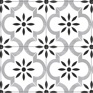 以下が含まれることがあります： 黒と白のパターンが施されたセラミックタイルで、花柄のデザインが施されています。タイルは白地に黒の花柄のモチーフが描かれています。