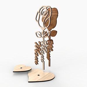 May include: Wooden cutout of a rose with the word "Mom" in a decorative script. The rose is attached to a heart-shaped base.