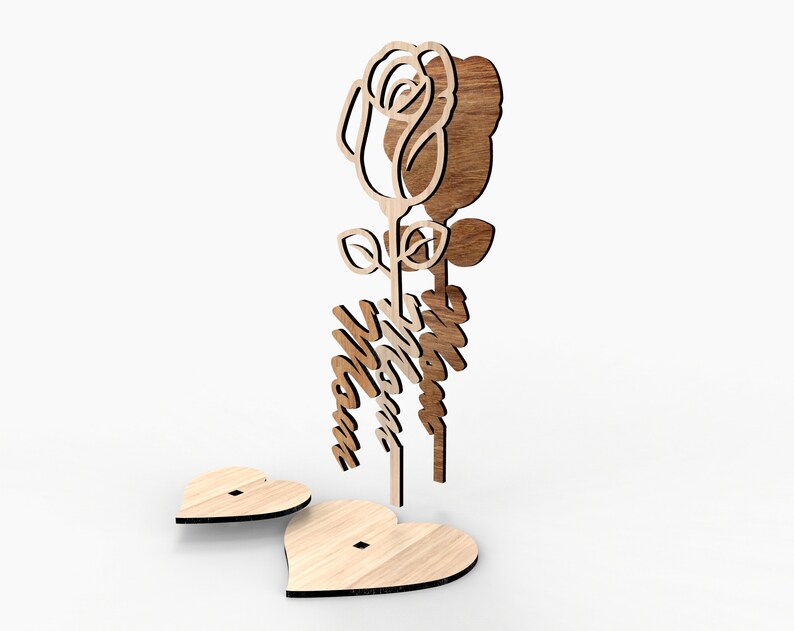 May include: Wooden cutout of a rose with the word "Mom" in a decorative script. The rose is attached to a heart-shaped base.