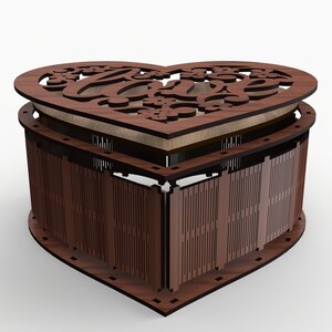 May include: A wooden heart-shaped box with a cutout design of the word "love" and floral accents. The box is open and the lid is resting on top.