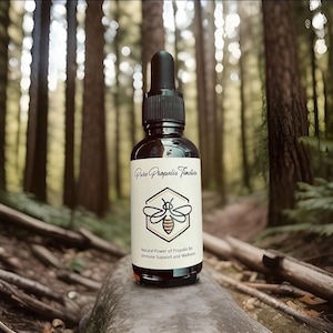 May include: A dark brown glass bottle with a dropper top, labelled "Pure Propolis Tincture". The label also features a stylised bee illustration and the text "Natural Power of Propolis for Immune Support and Wellness."