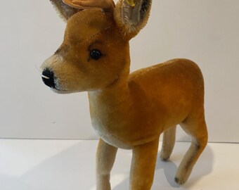 Steiff 1950's Mohair deer with silver raised script button and stock tag