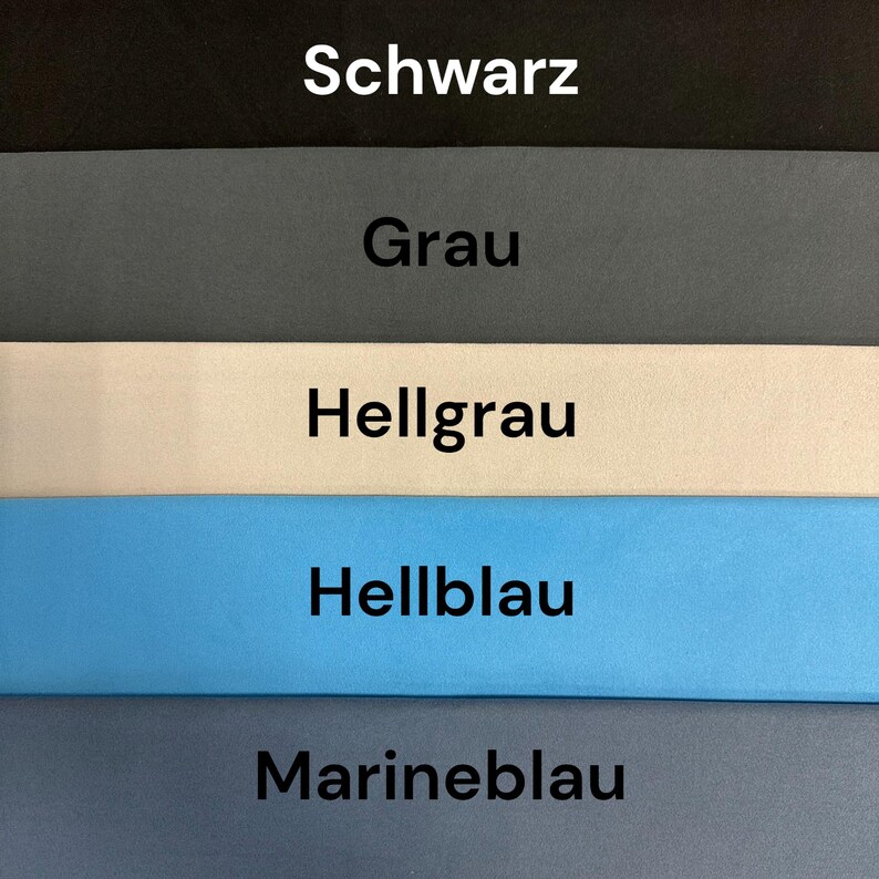 May include: A color chart featuring five horizontal bands of solid fabric in descending order: black, gray, light gray, light blue, and navy blue. Each band contains a centered text label in German: Schwarz, Grau, Hellgrau, Hellblau, and Marineblau.