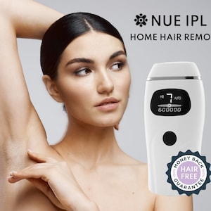 May include: White home hair removal device with a digital display showing "HR 7 AUTO 600000". The device has a black button and a money back guarantee label that says "100% Hair Free 100% Guarantee".