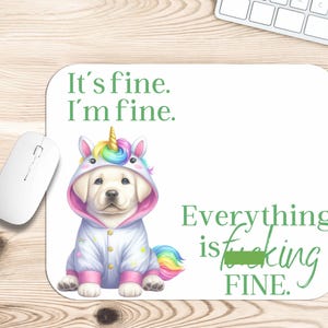 May include: White rectangular mousepad with a cartoon image of a yellow Labrador puppy wearing a unicorn costume. The mousepad has the text "It's fine. I'm fine." and "Everything is fine."