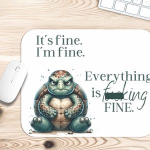 May include: A white mouse pad with a green turtle illustration and the text "It's fine. I'm fine. Everything is f***ing FINE."