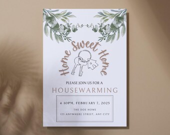 May include: A white card with green foliage border and brown text that reads "Home Sweet Home" with a key and house illustration. The text below reads "Please join us for a Housewarming" with the date and time "4-10PM, February 7, 2025" and the address "The Doe Home, 123 Anywhere Street, Any City".