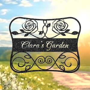 May include: Black metal garden sign with two roses and the text "Clara's Garden".
