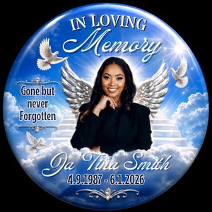 May include: A circular memorial plaque featuring a portrait of a person with dark hair wearing a black blazer. The background shows a blue sky, white clouds, a staircase, and white doves. Text reads: In Loving Memory, Gone but never Forgotten, Ja Tina Smith, 4.9.1987 - 6.1.2026.