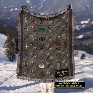 May include: A gray blanket with various pixelated icons and the number 99 repeated throughout. The blanket has a black border and fringe. The text "Total level: 2277" is visible. The blanket is available with and without sailing skill.