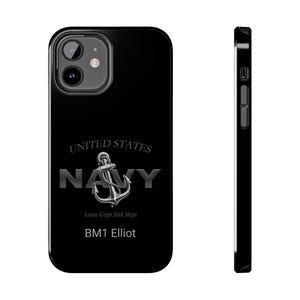 May include: Black phone case with a silver United States Navy logo, an anchor, and the text "Loose Grips Sink Ships" and "BM1 Elliot".