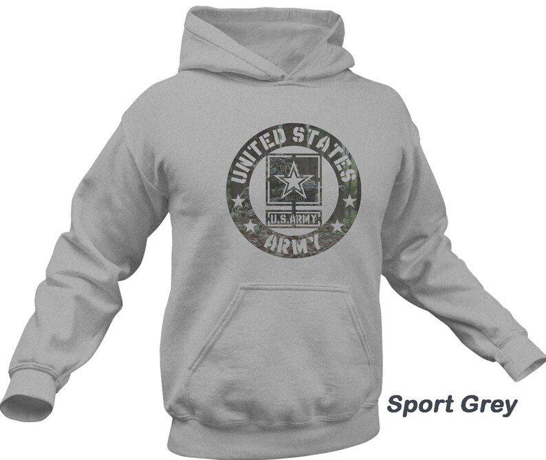 May include: A gray hooded sweatshirt with a distressed, camouflage-style graphic of a US Army logo. The logo features a star and the words "United States Army".