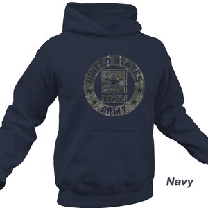May include: Navy blue hooded sweatshirt with a camouflage print circle graphic featuring the text "United States Army" and a star.