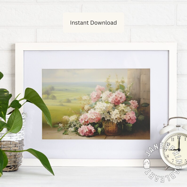 May include: A framed painting of a bouquet of pink and white hydrangeas in a wicker basket. The flowers are in front of a stone wall and a green field.