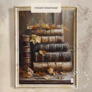 Peut inclure: Impression d'art encadrée représentant une pile de vieux livres aux dos dorés et aux couvertures usées. Des feuilles d'automne sont posées sur les livres. Le texte "Instant Download" est visible.