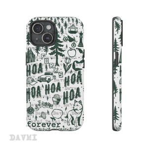 May include: A white phone case with a dark green pattern featuring trees, a wolf, and the text "HOA forever." The case has a camera cutout and a side view showing a repeating tree design. The case is designed for a smartphone.