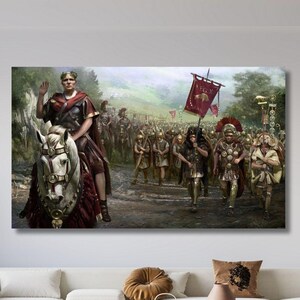 May include: A rectangular wall art print depicting a Roman general in a red cloak riding a white horse, leading a legion of soldiers in armour through a forest. The soldiers carry spears and a red banner with a gold emblem, creating a historical scene.